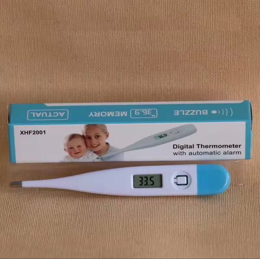 Digital thermometer with packaging on a beige background