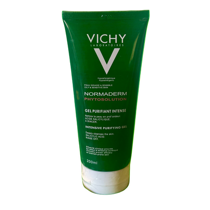 Vichy Normaderm Phytosolution gel tube on a green fabric background