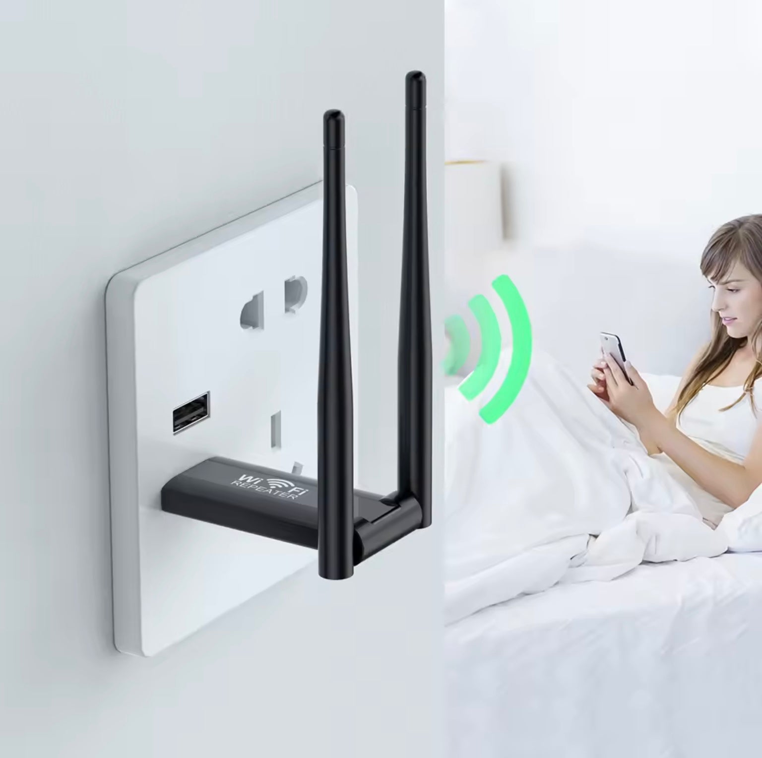 Wireless router with antennas attached to a wall socket, with a person using a smartphone in the background.
