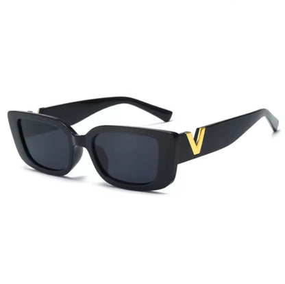 Black sunglasses with a gold 'V' on the arm against a white background